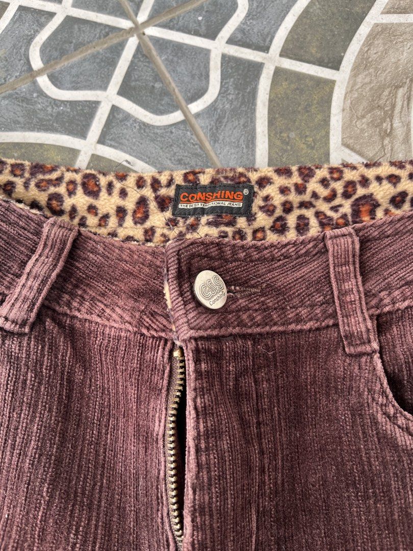 CONSHING Corduroy Flare Jeans Leopard Print Lined (Category: Jeans) located in Manila. Submitted by yeuh_coll (Listing ID 1453261241, Image 2). Description: - Brand: CONSHING - Style: Brown corduroy flare jeans - Unique Feature: Leopard print lining inside the waistband - Design: Classic five-pocket styling - Closure: Zip fly with button - Leg Style: Subtle flare - Aesthetic: Perfect for a retro-inspired look.
