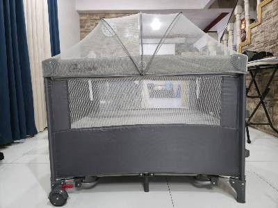 Crib for baby (Category: Cots & Cribs) located in Makati City. Submitted by michellnoz50229 (Listing ID 1453239165, Image 1). Description: Cocobb Baby Crib Standard size (100 x 74 x 70 cm) With Mosquito net Has co-sleeper on one side Color Gray Weight Capacity: - Layer 1 (Crib/Bed): 0 to 36 months - Layer 2 (Bassinet/Playpen): 0 to 6 years (varies by height) Materials: Heavy-duty steel support structure, reinforced oxford cloth, and transparent, 