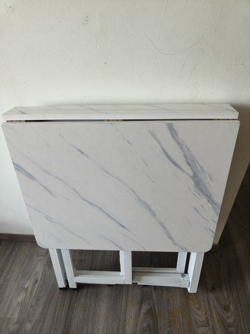 Foldable table (Category: Tables & Sets) located in Singapore. Submitted by wowhousewares (Listing ID 1453328109, Image 2). Description: bottom 1 foot is lost, so it's not even like the picture 3.
