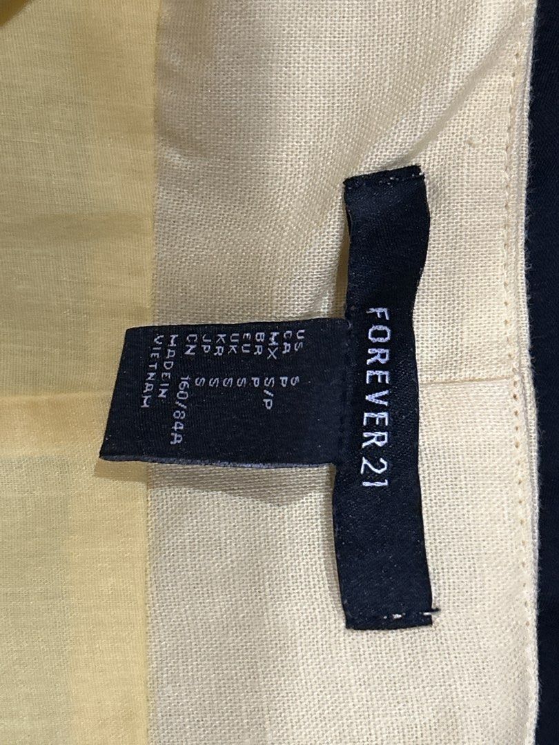 Forever 21 Yellow Tie Front Mini Dress (Category: Dresses) located in Caloocan City. Submitted by kmlghr (Listing ID 1453384910, Image 3). Description: Forever 21 Cute yellow mini dress Tie front detail, adjustable tie straps, side zip closure Size S .