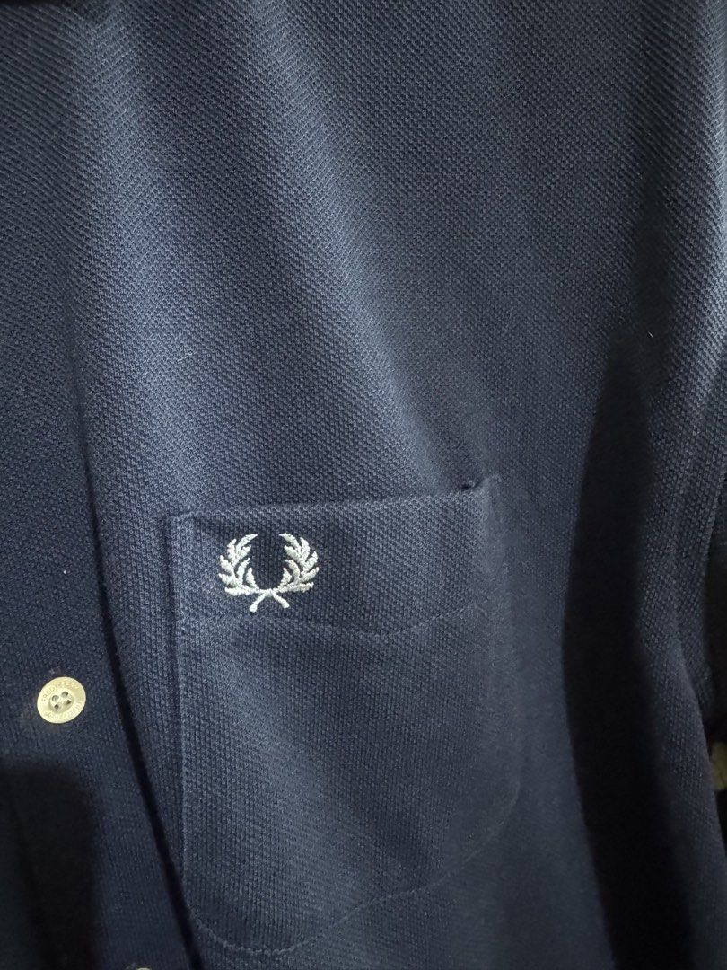 Fred Perry Navy Blue Polo Shirt Size S (Category: Tshirts & Polo Shirts ) located in San Jose. Submitted by strictlyRL (Listing ID 1453392379, Image 3). Description: - Navy blue Fred Perry polo shirt - Size S - Short sleeves - Button-up front - Chest pocket with iconic laurel wreath logo - Ideal for casual wear dimes: 20 width 25 length.
