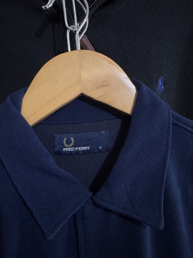 Fred Perry Navy Blue Polo Shirt Size S (Category: Tshirts & Polo Shirts ) located in San Jose. Submitted by strictlyRL (Listing ID 1453392379, Image 2). Description: - Navy blue Fred Perry polo shirt - Size S - Short sleeves - Button-up front - Chest pocket with iconic laurel wreath logo - Ideal for casual wear dimes: 20 width 25 length.