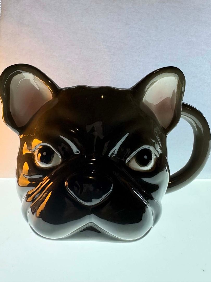 French Bulldog 3D Ceramic Mug (Category: Coffee & Tea Tableware) located in Caloocan City. Submitted by rabbithole2026 (Listing ID 1453366515, Image 3). Description: Features: 3D French Bulldog face design Glossy ceramic construction Brown and cream color scheme Large comfortable handle Great for coffee, tea, cocoa, or display Perfect for Frenchie lovers and dog-themed collections Condition: Very good condition overall. There is a minor chip on t
