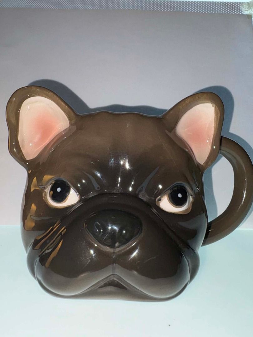 French Bulldog 3D Ceramic Mug (Category: Coffee & Tea Tableware) located in Caloocan City. Submitted by rabbithole2026 (Listing ID 1453366515, Image 1). Description: Features: 3D French Bulldog face design Glossy ceramic construction Brown and cream color scheme Large comfortable handle Great for coffee, tea, cocoa, or display Perfect for Frenchie lovers and dog-themed collections Condition: Very good condition overall. There is a minor chip on t
