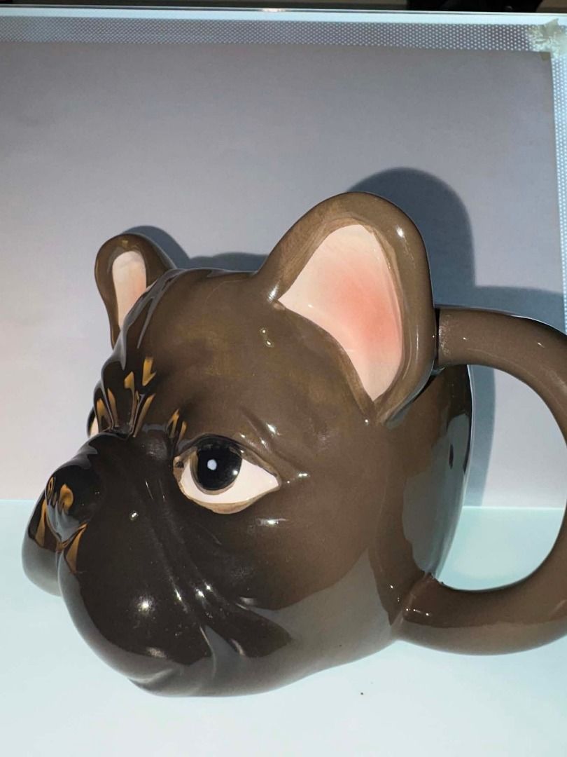 French Bulldog 3D Ceramic Mug (Category: Coffee & Tea Tableware) located in Caloocan City. Submitted by rabbithole2026 (Listing ID 1453366515, Image 2). Description: Features: 3D French Bulldog face design Glossy ceramic construction Brown and cream color scheme Large comfortable handle Great for coffee, tea, cocoa, or display Perfect for Frenchie lovers and dog-themed collections Condition: Very good condition overall. There is a minor chip on t