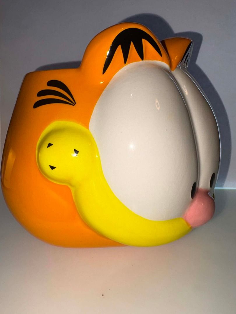Garfield Ceramic Holder Organizer Container (Category: Coffee & Tea Tableware) located in Caloocan City. Submitted by rabbithole2026 (Listing ID 1453364131, Image 2). Description: Official licensed Garfield collectible featuring Garfield hugging Pooky. Perfect as a pen holder, desk organizer, candy holder, planter cover, or display piece. Excellent condition. Designed in Spain ©2024 Paws, Inc..