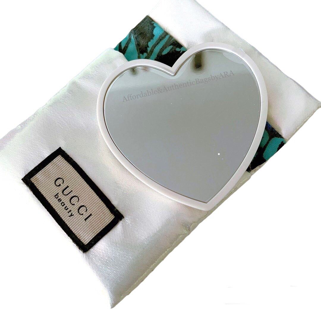 GWP GUCCI WHITE HEART COMPACT MIRROR (Category: Makeup) located in Daet. Submitted by ecassenluxuries (Listing ID 1453299728, Image 2). Description: 📌 FIXED PRICE ALREADY ▫️Authentic GWP Gucci Beauty heart-shaped mirror ▫️Includes original white satin pouch with black button closure ▫️Features a Gucci Beauty tag on the pouch ▫️Ideal for convenient touch-ups anywhere ▫️Compact and charming design ✅ All items are guaranteed 💯% AUTHENTIC ✅ Onhand 
