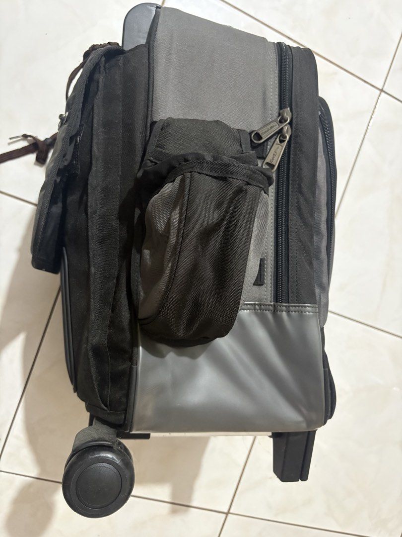 Hawk Rolling Backpack Luggage Bag (Category: Backpacks) located in Imus. Submitted by Erins_Box (Listing ID 1453262561, Image 2). Description: - Hawk rolling backpack - Color: Black and Grey - Features wheels and a retractable pull-up handle - Multiple compartments for organized storage - Includes side pockets - Ideal for school or travel - Zippers are in good working condition - Interior is clean.