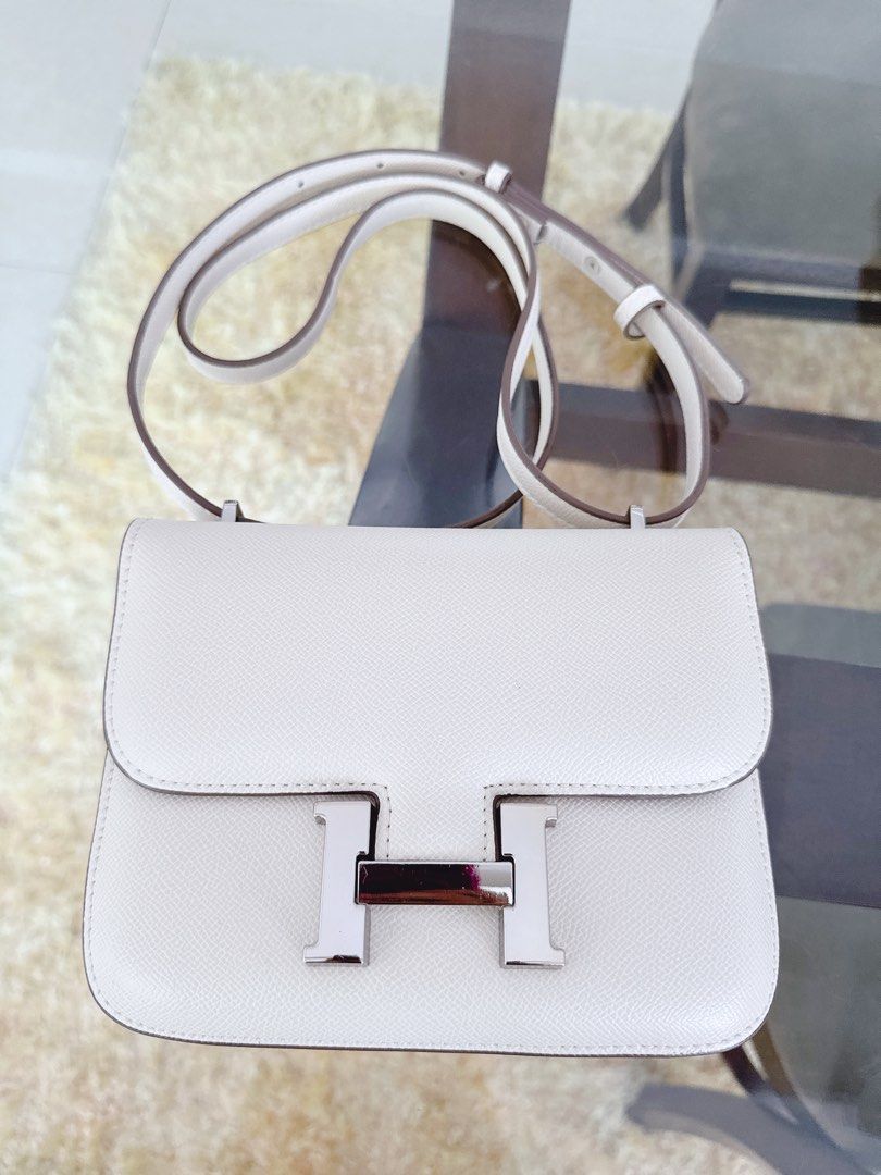 Hermes Constance Bag White Epsom Leather Silver Hardware (Category: Luxury Bags & Wallets) located in Makati City. Submitted by lovehobshop (Listing ID 1453423287, Image 1). Description: - Hermes Constance Bag inspired only - Material: Epsom Leather - Hardware: Silver Closure - Interior: Clean - Strap: Long strap for shoulder/crossbody wear - Style: Classic, versatile for daily use or special occasions Minimal sign of wear-very light stain on the