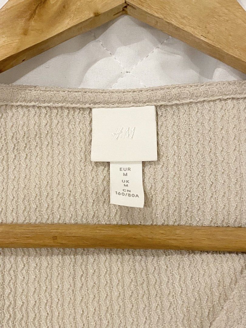 H&M Beige Romper (Category: Rompers) located in Iloilo. Submitted by shopfromhomeph.co (Listing ID 1453281977, Image 2). Description: Flaw: tiny black dot as seen on 3rd photo.