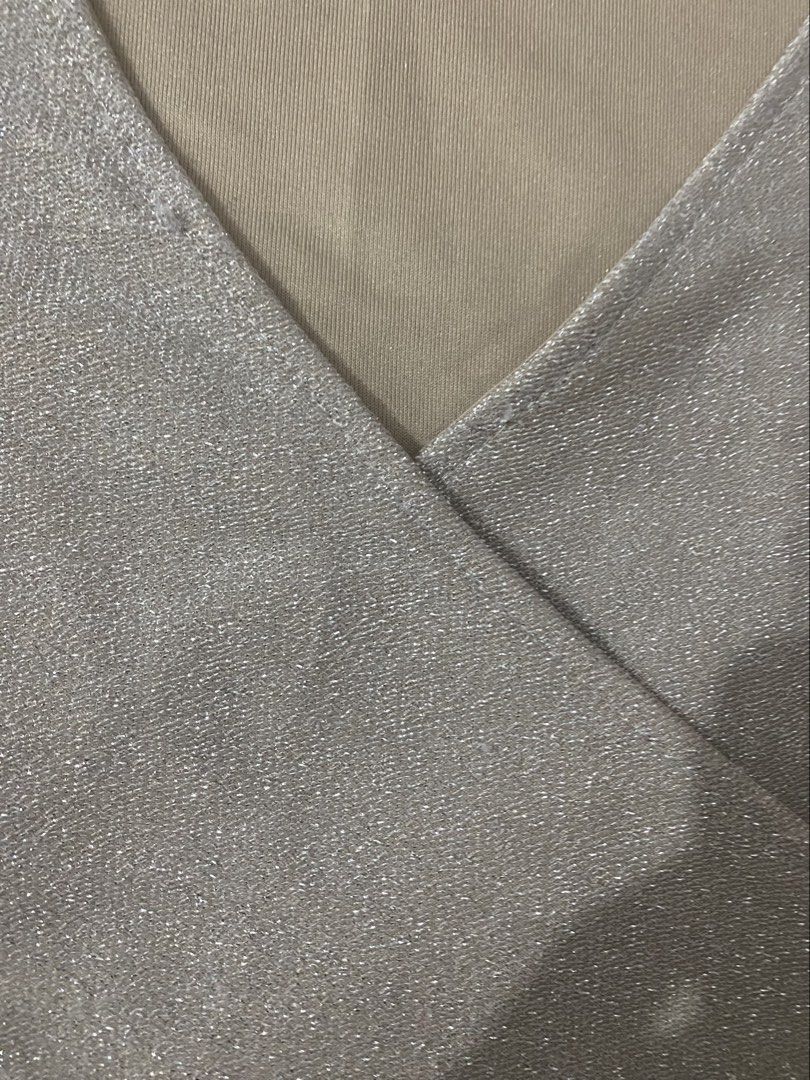 H&M Divided Silver Sparkly Wrap Crop Top XS (Category: Sleeveless) located in Gapan. Submitted by sonikku (Listing ID 1453369577, Image 3). Description: - Sparkly wrap crop top - Brand: H&M Divided - Size: XS - Features: V-neckline, short sleeves, subtle shimmer - Style: Dress up or down, pairs well with jeans or skirts.