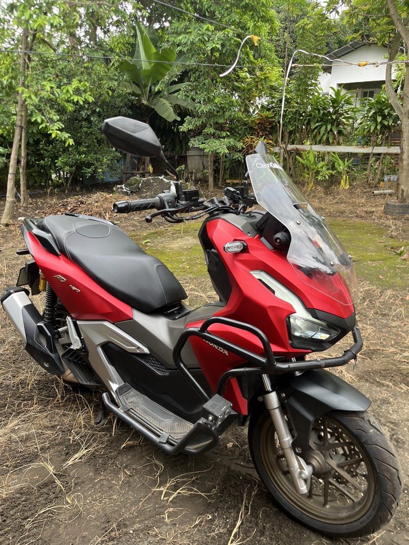 Honda ADV 160 Scooter (Category: Motorbikes for Sale) located in Calaca. Submitted by markzyyy (Listing ID 1453294367, Image 3). Description: 🚨 FOR SALE: HONDA ADV 160 (RED) – GOOD AS NEW! 🔥 Looking for a premium scooter that’s ready to ride? This is your chance to own a well-maintained Honda ADV 160 at a great price! ✅ Odometer: 8,980.5 KM only ✅ Freshly changed oil ✅ Brand new front & rear tires ✅ Upgraded with customized bracket & bright LED