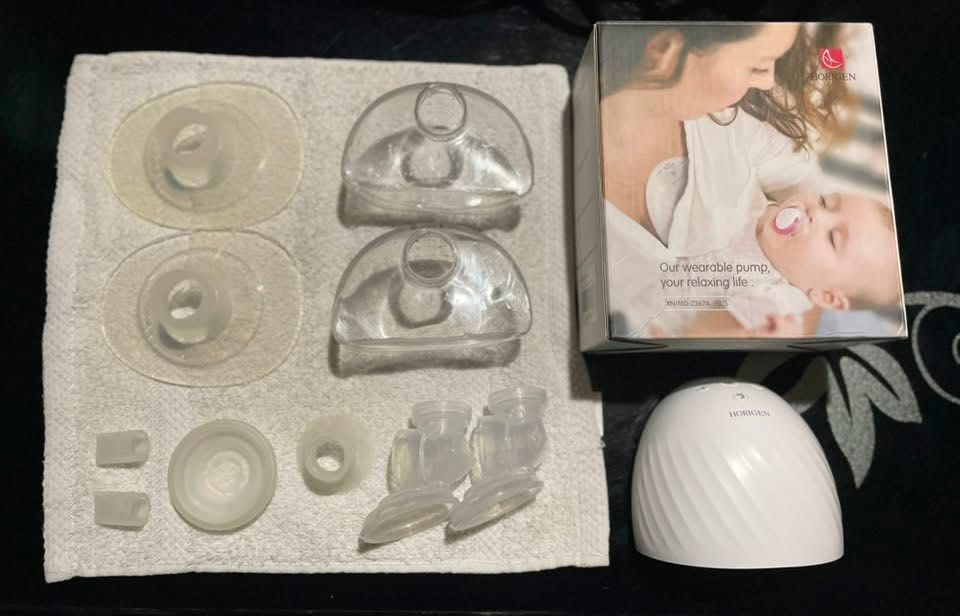 Horigen Wearable Breast Pump (Category: Breastfeeding & Bottle Feeding) located in Zamboanga. Submitted by declutterbyali_ (Listing ID 1453329519, Image 1). Description: - Horigen wearable breast pump - Includes main unit, collection cups, and all accessories shown in photos - Original box included - Designed for comfortable and discreet pumping - Ideal for busy moms and on-the-go use With extra accesories selling for 1k (slight nego🙃) zamboanga