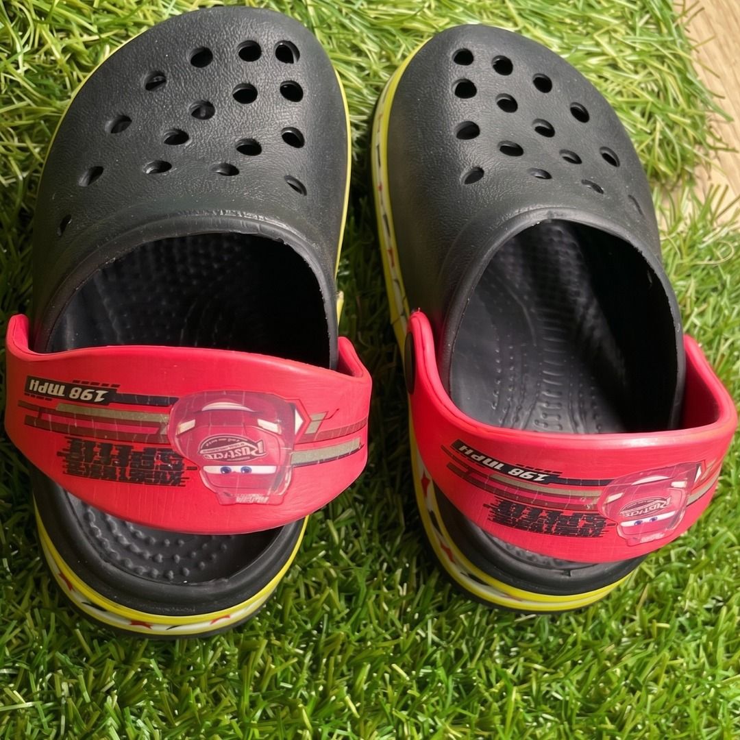 Kids' Crocs Lightning McQueen Clogs Size 16 (Category: Babies & Kids Fashion) located in Quezon City. Submitted by eilgaraje (Listing ID 1453401325, Image 2). Description: - Black Crocs with iconic red Lightning McQueen straps. - Features a fun yellow trim around the sole. - Designed for little fans of the Cars movie. - Easy slip-on, slip-off style for kids. - Ideal for playtime, beach trips, or casual outings. - Made in China. as posted used in 