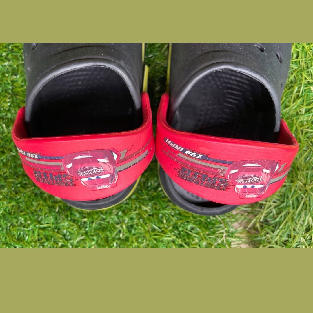 Kids' Crocs Lightning McQueen Clogs Size 16 (Category: Babies & Kids Fashion) located in Quezon City. Submitted by eilgaraje (Listing ID 1453401325, Image 3). Description: - Black Crocs with iconic red Lightning McQueen straps. - Features a fun yellow trim around the sole. - Designed for little fans of the Cars movie. - Easy slip-on, slip-off style for kids. - Ideal for playtime, beach trips, or casual outings. - Made in China. as posted used in 