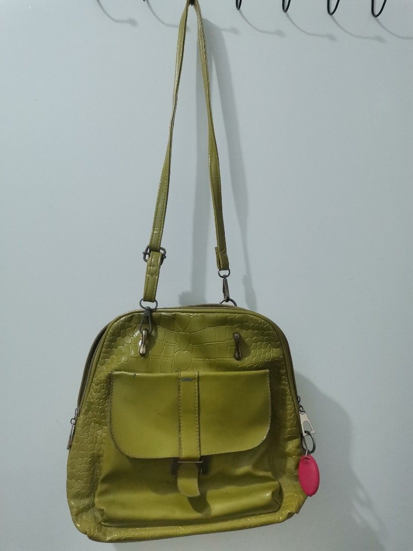 Kimbel Green Crocodile Textured Shoulder Bag (Category: Shoulder Bags) located in Binan City. Submitted by fab_onlineshoppe (Listing ID 1453287247, Image 1). Description: - Stylish green shoulder bag with a unique crocodile texture. - Features a convenient front flap pocket with a secure buckle closure. - Main compartment opens with a zip for easy access. - Adjustable shoulder strap for comfortable wear. - Please note: Bag shows some signs of wea