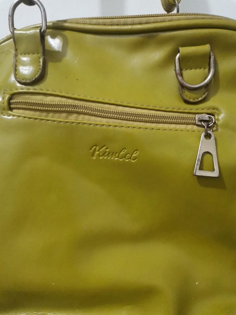 Kimbel Green Crocodile Textured Shoulder Bag (Category: Shoulder Bags) located in Binan City. Submitted by fab_onlineshoppe (Listing ID 1453287247, Image 2). Description: - Stylish green shoulder bag with a unique crocodile texture. - Features a convenient front flap pocket with a secure buckle closure. - Main compartment opens with a zip for easy access. - Adjustable shoulder strap for comfortable wear. - Please note: Bag shows some signs of wea