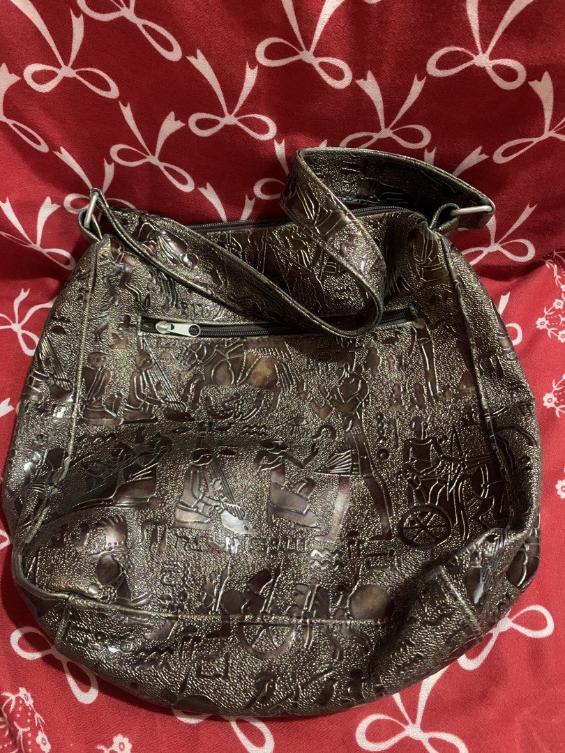 KIMBEL INTERNATIONAL Embossed Shoulder Bag (Category: Shoulder Bags) located in Manila. Submitted by elaitems (Listing ID 1453329159, Image 1). Description: - Cool embossed shoulder bag from KIMBEL INTERNATIONAL - Unique pattern all over - Zipper closure - Interior pockets - Adjustable strap - Great for everyday use.