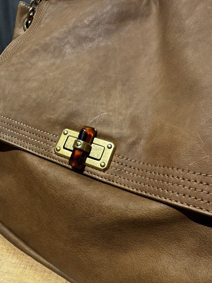 Lanvin Paris Brown Leather Chain Convertible Shoulder Bag (Category: Luxury Bags & Wallets) located in Mandaluyong City. Submitted by j4yw3e (Listing ID 1453329685, Image 2). Description: - Authentic Lanvin Paris brown leather convertible chain shoulder bag - brass gold hardware with a tortoise shell turn lock closure; includes a coin charm with the logo - minimal signs of use on the body but nothing too obvious. Stitches intact, overall in good 