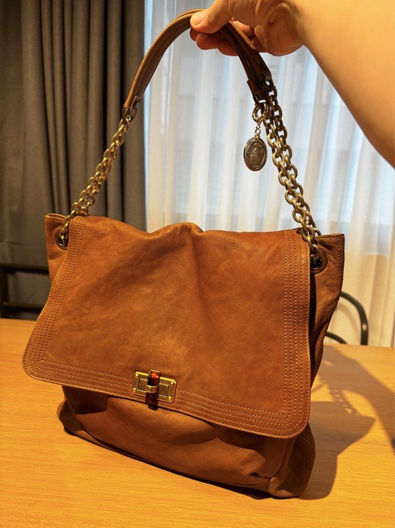 Lanvin Paris Brown Leather Chain Convertible Shoulder Bag (Category: Luxury Bags & Wallets) located in Mandaluyong City. Submitted by j4yw3e (Listing ID 1453329685, Image 1). Description: - Authentic Lanvin Paris brown leather convertible chain shoulder bag - brass gold hardware with a tortoise shell turn lock closure; includes a coin charm with the logo - minimal signs of use on the body but nothing too obvious. Stitches intact, overall in good 