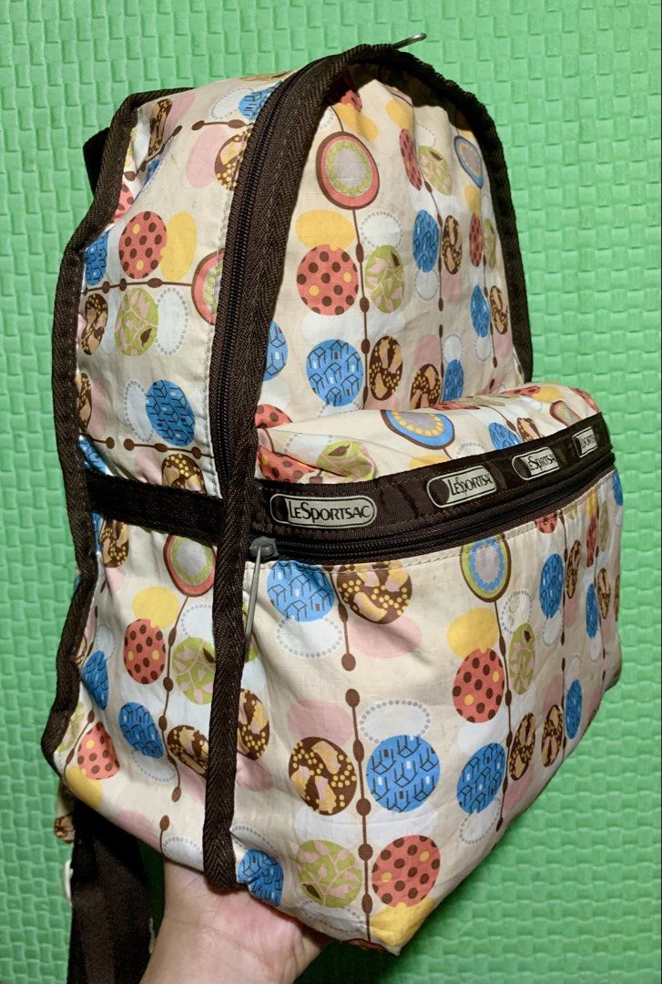 LeSportsac Backpack - Fun Colorful Circles Pattern (Category: Backpacks) located in Carigara. Submitted by spark2503 (Listing ID 1453270088, Image 2). Description: - Cute LeSportsac backpack - Fun, colorful circle pattern - Brown trim and straps - Secure zip closure - Plenty of space for essentials - Perfect for everyday use or travel.