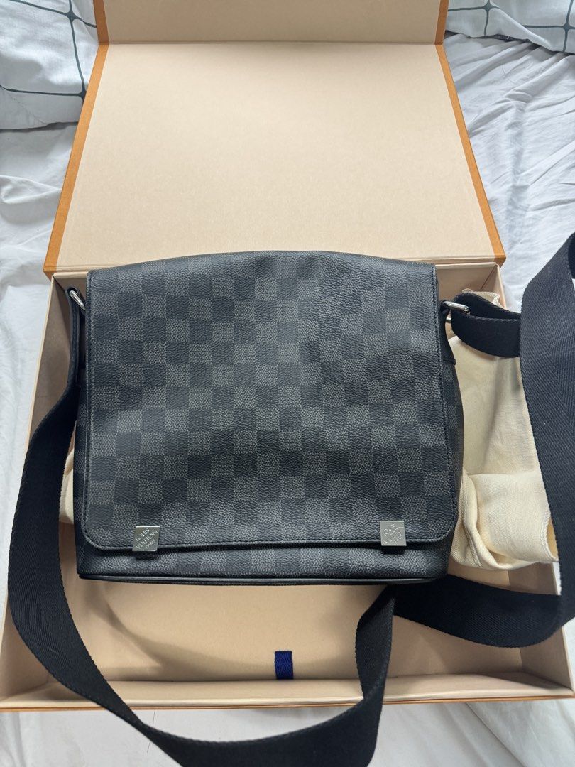Louis Vuitton Damier Graphite Messenger Bag (Category: Luxury Bags & Wallets) located in Las Pinas. Submitted by jjrr42 (Listing ID 1453322152, Image 1). Description: Authentic Louis Vuitton Damier Graphite Canvas District MM Messenger Bag. Made in Spain. Comes with dust bag and box. Great for daily use. Bought in New Jersey in 2019. Comes with original gift receipt. Spots from non use and storage on the dust bag and the box but other than that n
