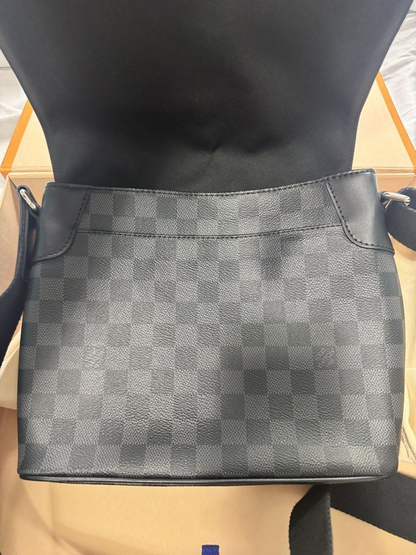 Louis Vuitton Damier Graphite Messenger Bag (Category: Luxury Bags & Wallets) located in Las Pinas. Submitted by jjrr42 (Listing ID 1453322152, Image 2). Description: Authentic Louis Vuitton Damier Graphite Canvas District MM Messenger Bag. Made in Spain. Comes with dust bag and box. Great for daily use. Bought in New Jersey in 2019. Comes with original gift receipt. Spots from non use and storage on the dust bag and the box but other than that n