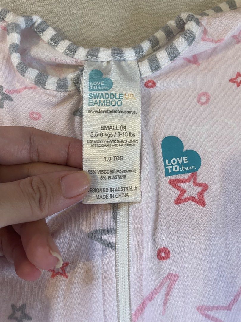 Love To Dream Swaddle Up (Category: Babies & Kids Fashion) located in Quezon City. Submitted by mama_of_three (Listing ID 1453325757, Image 3). Description: - Grey Love To Dream swaddle - Easy zipper closure for quick changes - Wings provide a secure, womb-like feeling - Soft fabric for baby's comfort - Ideal for transitioning from the womb - Pink swaddle with stars also available - size small P300 each, 550 for both Sf c/o buyer. Pick up loc is 