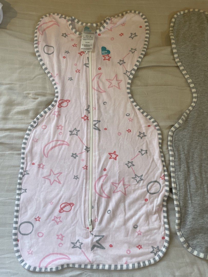 Love To Dream Swaddle Up (Category: Babies & Kids Fashion) located in Quezon City. Submitted by mama_of_three (Listing ID 1453325757, Image 2). Description: - Grey Love To Dream swaddle - Easy zipper closure for quick changes - Wings provide a secure, womb-like feeling - Soft fabric for baby's comfort - Ideal for transitioning from the womb - Pink swaddle with stars also available - size small P300 each, 550 for both Sf c/o buyer. Pick up loc is 