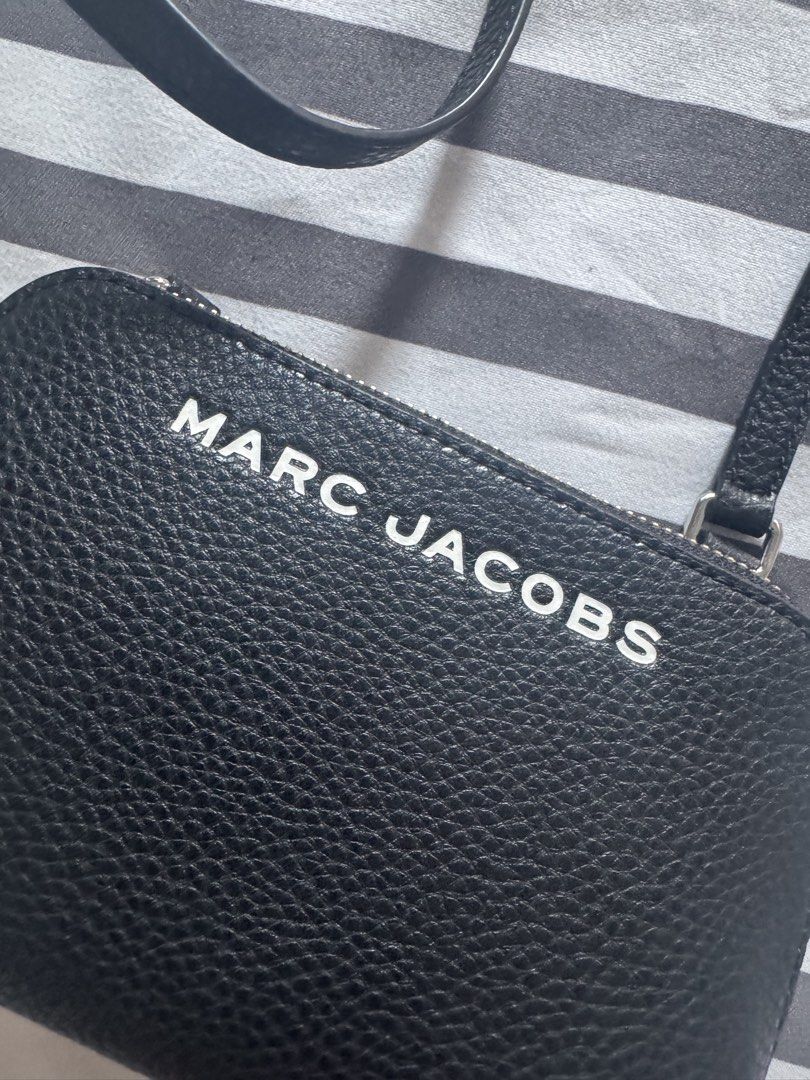 Marc Jacobs Black Leather Crossbody Bag (Category: Luxury Bags & Wallets) located in Makati City. Submitted by kpmg111 (Listing ID 1453263016, Image 2). Description: Marc Jacobs Black pebbled leather Closure: Zip Interior: Card slots No flaws. No dustbag. Adjustable strap, silver-tone hardware Small and compact, ideal for essentials Guaranteed authentic or money back 10x. PM for inquiries..