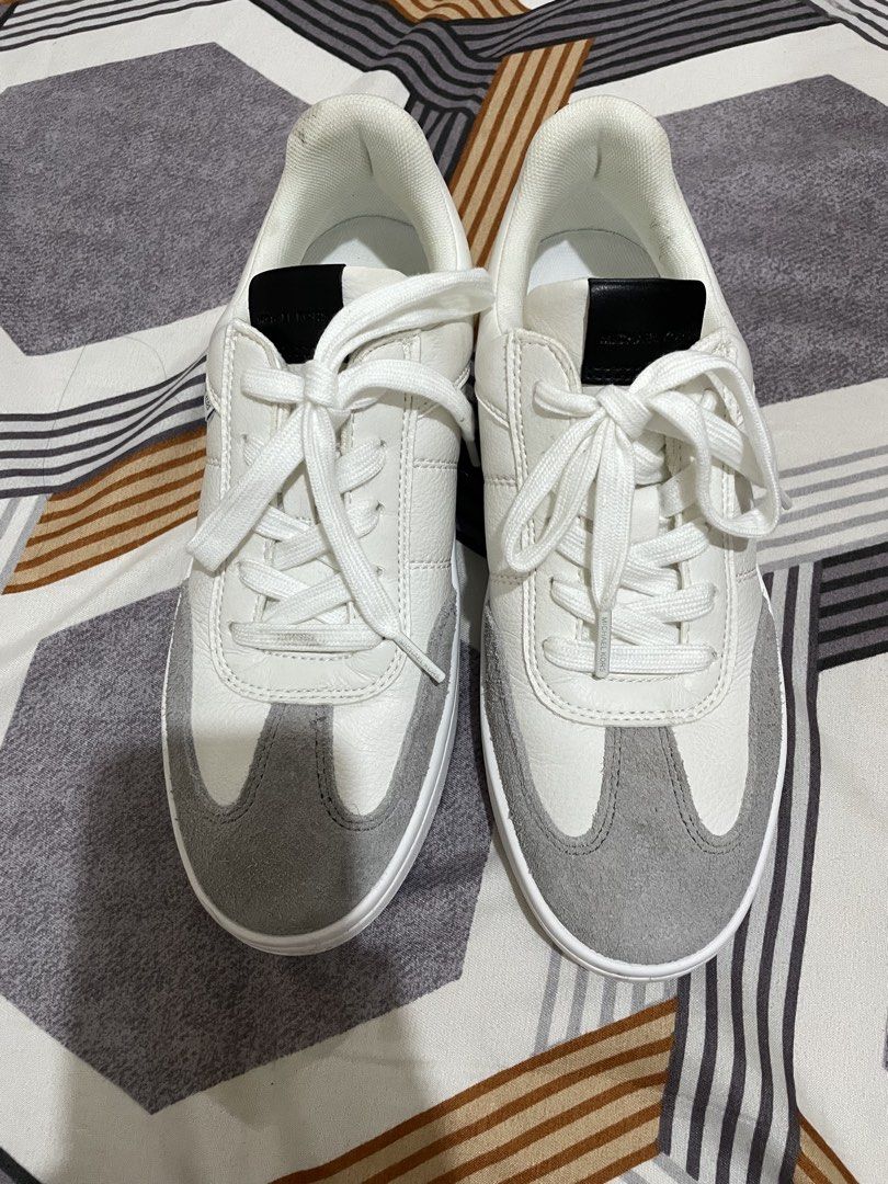 Michael Kors White and Grey Leather Sneakers (Category: Sneakers) located in Tanza. Submitted by declutchedd_dd (Listing ID 1453366299, Image 2). Description: - Michael Kors white and grey leather sneakers - Lace-up style for a secure fit - Comfortable for all-day wear - Features Michael Kors logo on the side and sole - Ideal for casual outfits - Comes with original laces.