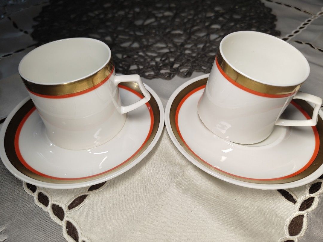 Mikasa Bone China Cabernet Coffee Cups and Saucers Set (Category: Coffee & Tea Tableware) located in Zamboanga. Submitted by lunavinum (Listing ID 1453342837, Image 1). Description: - Set of 2 Mikasa coffee cups and saucers - Bone China, Cabernet collection - Elegant white with gold and orange trim - Ideal for coffee or espresso - Perfect for hosting small gatherings or as a thoughtful gift - Clean and ready for a new home.