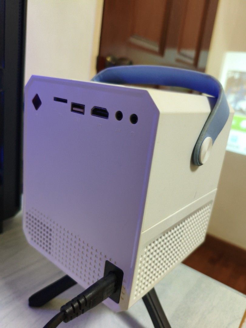 Mini Android Projector (Category: Projectors) located in Singapore. Submitted by chestyechy (Listing ID 1453364864, Image 2). Description: Power adapter not included, can't seem to change to HDMI output for some reasons **** MEETUP ONLY AT MY BLOCK THERE FOR MY CONVENIENCE **** Delivery fee - $2 Negotiable.