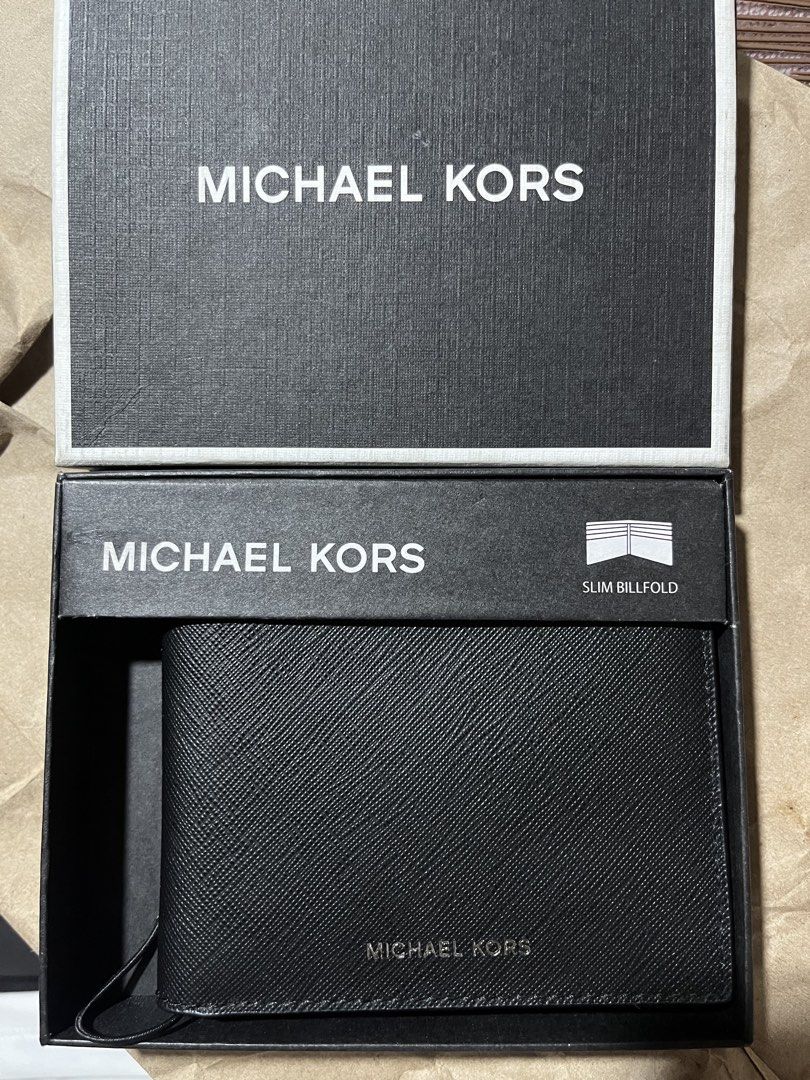 Michael Kors Slim Billfold Men’s Wallet (Category: Wallets & Card Holders) located in Manila. Submitted by i.reco.buy.it (Listing ID 1453371686, Image 1). Description: - Authentic Michael Kors Slim Billfold - Michael Kors logo minimal print - Black leather interior - Multiple card slots - Comes with original box - Ideal for everyday use 100% original from USA/Canada Brand new Moneyback guarantee if proven fake Open for lay away Still Negotiable P