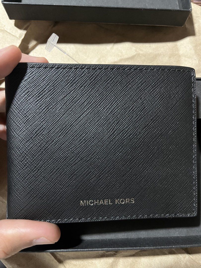 Michael Kors Slim Billfold Men’s Wallet (Category: Wallets & Card Holders) located in Manila. Submitted by i.reco.buy.it (Listing ID 1453371686, Image 2). Description: - Authentic Michael Kors Slim Billfold - Michael Kors logo minimal print - Black leather interior - Multiple card slots - Comes with original box - Ideal for everyday use 100% original from USA/Canada Brand new Moneyback guarantee if proven fake Open for lay away Still Negotiable P