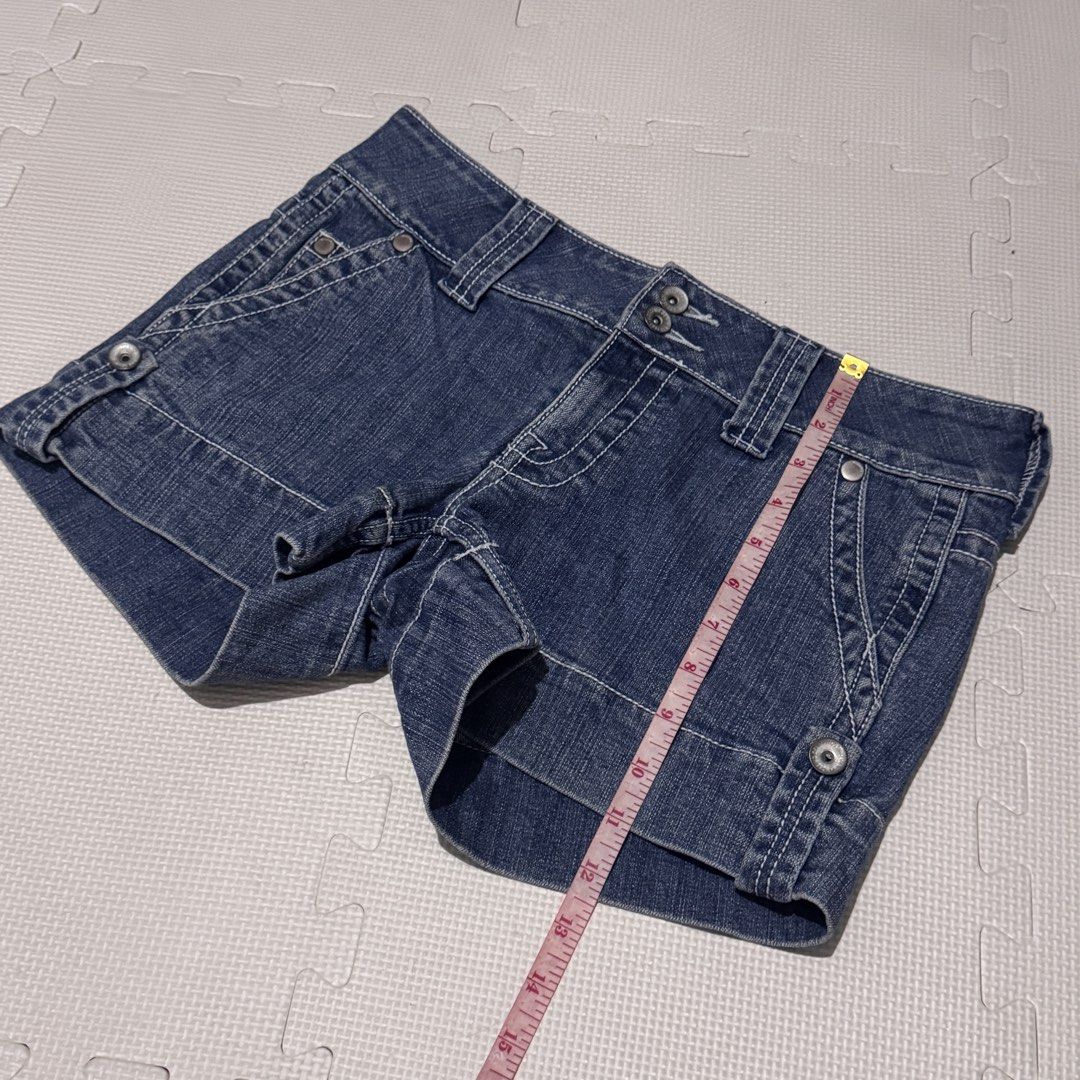 Mossimo Supply Co. Low Rise Denim Shorts (Category: Shorts) located in Marikina City. Submitted by prelovedsms (Listing ID 1453312787, Image 3). Description: - Mossimo Supply Co. low rise denim shorts - Size 9 - Dark wash denim with white stitching - Cuffed hem - Two button closure - V-stitch detail on back pockets - Measurements provided in photos.