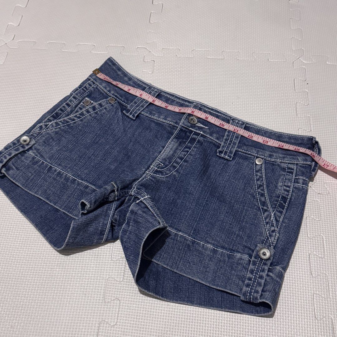 Mossimo Supply Co. Low Rise Denim Shorts (Category: Shorts) located in Marikina City. Submitted by prelovedsms (Listing ID 1453312787, Image 2). Description: - Mossimo Supply Co. low rise denim shorts - Size 9 - Dark wash denim with white stitching - Cuffed hem - Two button closure - V-stitch detail on back pockets - Measurements provided in photos.