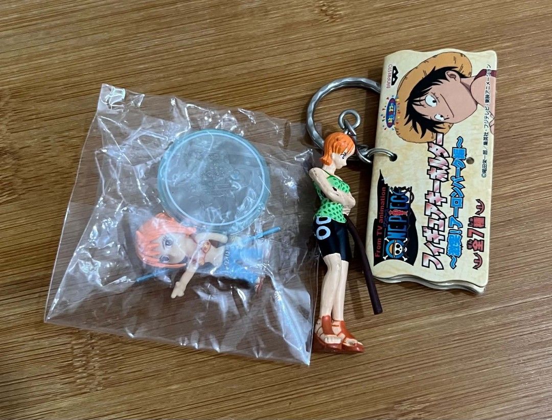NAMI - SET OF 2 - ONE PIECE FIGURES (Category: Figurines & Statues) located in Villasis. Submitted by aalvar.collection (Listing ID 1453362949, Image 2). Description: Selling Nami - Set of 2 - One Piece Figures for Php300 only. -wyswyg/loose condition -no issue -keychain & Figure -with markings Mop: Gcash Mod: Meetup, J&T or LBC (COP/COD) My Location: Villasis, Pangasinan Shipping: Open for shipping, Buyers will handle the expense Note: All items
