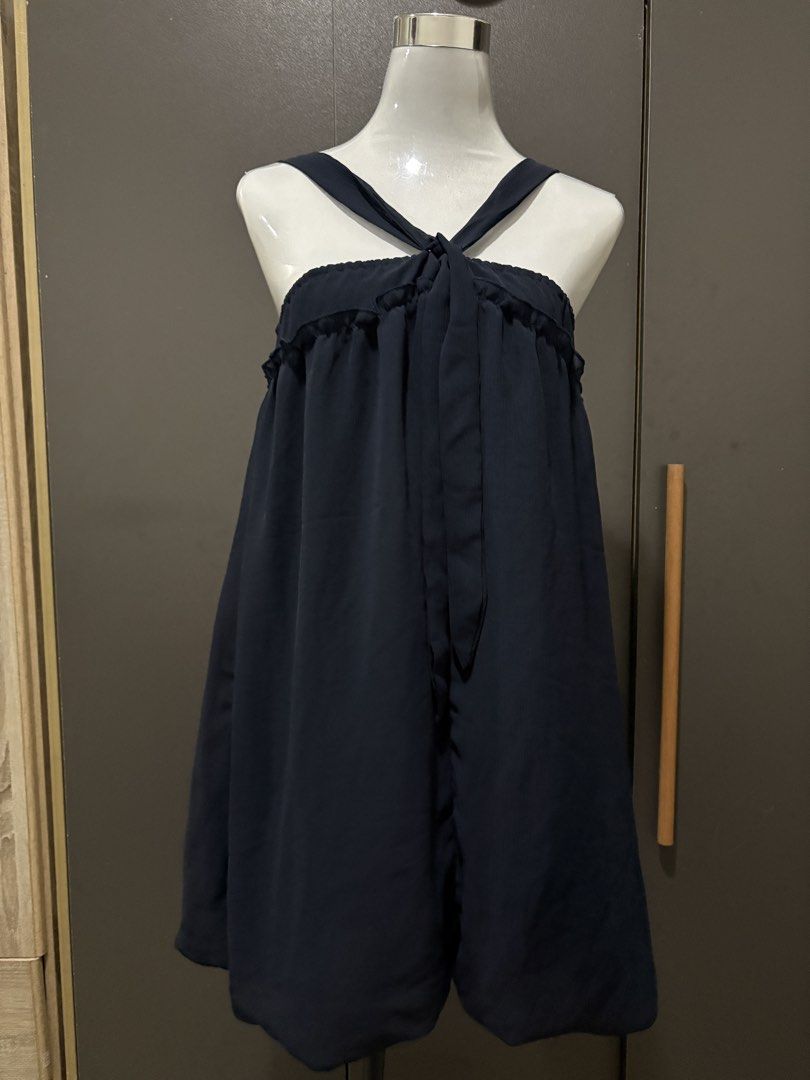 Navy Blue Ruffle Strap Dress with Tie Front (Category: Dresses) located in Manila. Submitted by roseannn_ (Listing ID 1453263645, Image 1). Description: - Navy blue dress - Ruffle trim along the bust - Criss-cross straps that tie at the front - Subtle textured fabric - Flowy and relaxed silhouette - Ideal for casual outings or beach days.