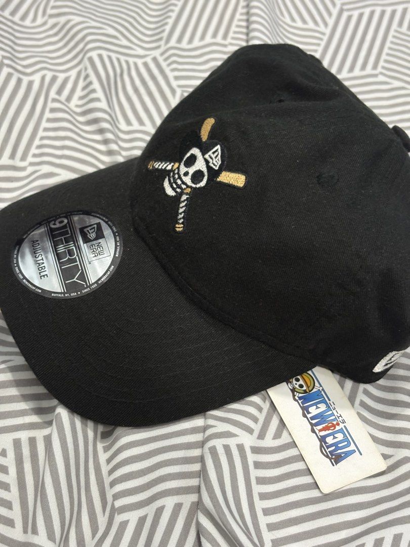 New Era 9Thirty One Piece Skull Logo Cap Black (Category: Caps & Hats) located in Manila. Submitted by sanctuss (Listing ID 1453249864, Image 2). Description: - Brand New Black New Era 9Thirty Cap - Features iconic One Piece Jolly Roger embroidered logo - Adjustable strap for a custom, comfortable fit - Comes with original tags attached - Ideal for any One Piece or anime enthusiast - Used it only for display - Rare item.