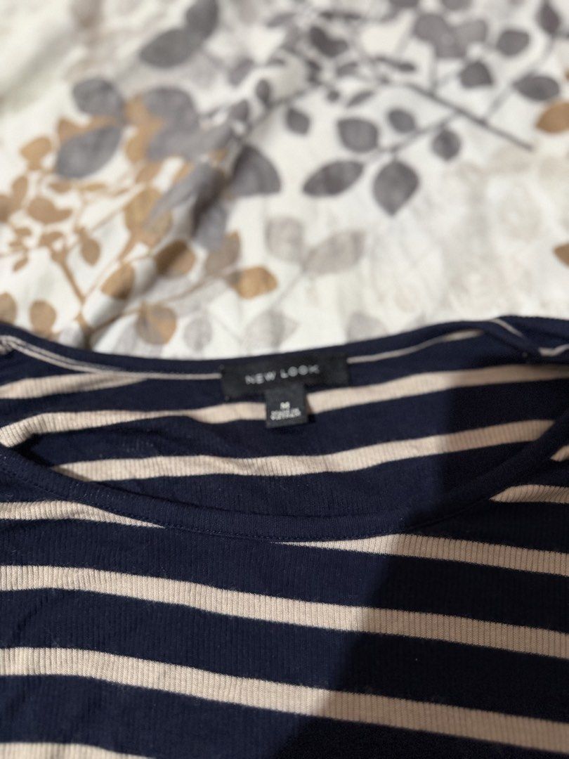New Look Striped Long Sleeve Tie Front Top Size M (Category: Blouses) located in Taytay. Submitted by cloudy_20 (Listing ID 1453378076, Image 2). Description: Navy & beige striped long sleeve top from New Look. Features a tie front hem and boat neckline. Size M..