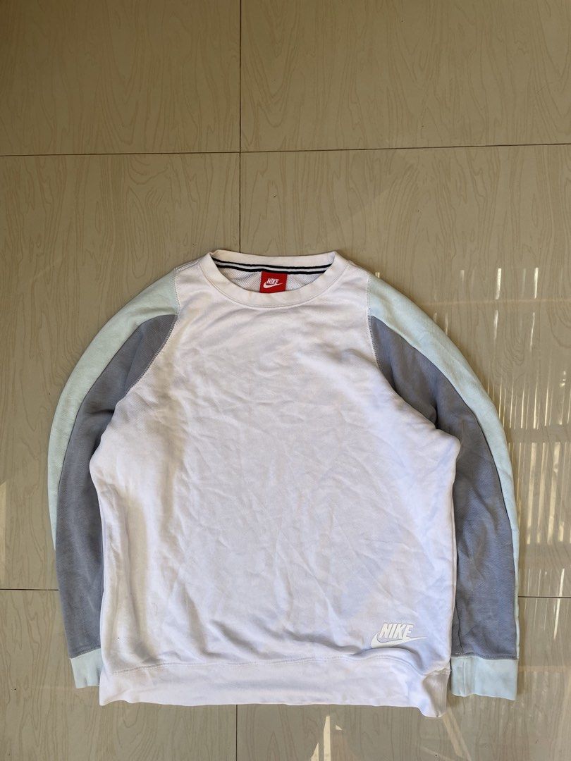 Nike White Grey Light Blue Colorblock Sweatshirt (Category: Coats, Jackets and Outerwear) located in Zamboanga. Submitted by guthens (Listing ID 1453339443, Image 1). Description: Condition- excellent Issue- none Color rate- 9.5/10.