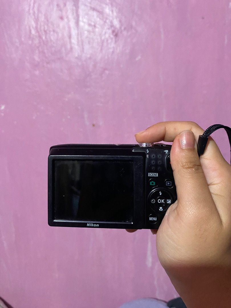 Nikon Coolpix S2800 (Category: Cameras) located in Caloocan City. Submitted by cheryllawa07146 (Listing ID 1453248400, Image 3). Description: - Black Nikon Coolpix s2800 - Comes with attached wrist strap - Screen displays 'Out of memory' message (may require memory card) - Features cute floral stickers on the front - Perfect for quick and easy snapshots ISSUES: - working sya pero walang shutter butoon (papagawa, nag-ask na ako sa quiapo around 1k