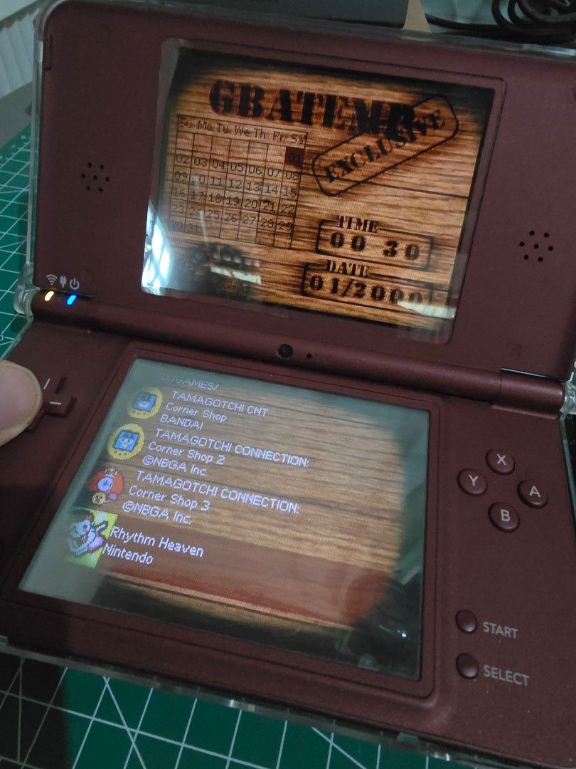 Nintendo DSi LL Burgundy (Category: Nintendo) located in Infanta. Submitted by acecarrot07 (Listing ID 1453249490, Image 3). Description: RFS: considering an upgrade to 3ds Issues: vignette on both screens, minor scratches - Nintendo DS LL (Burgundy) - Tested and working - Minor cosmetic scratches on the casing - Ideal for gaming on the go - MODDED inclusions: charger, stylus, R4 card, sd card, hard protective case Mode of payment: GCASH or Mari 