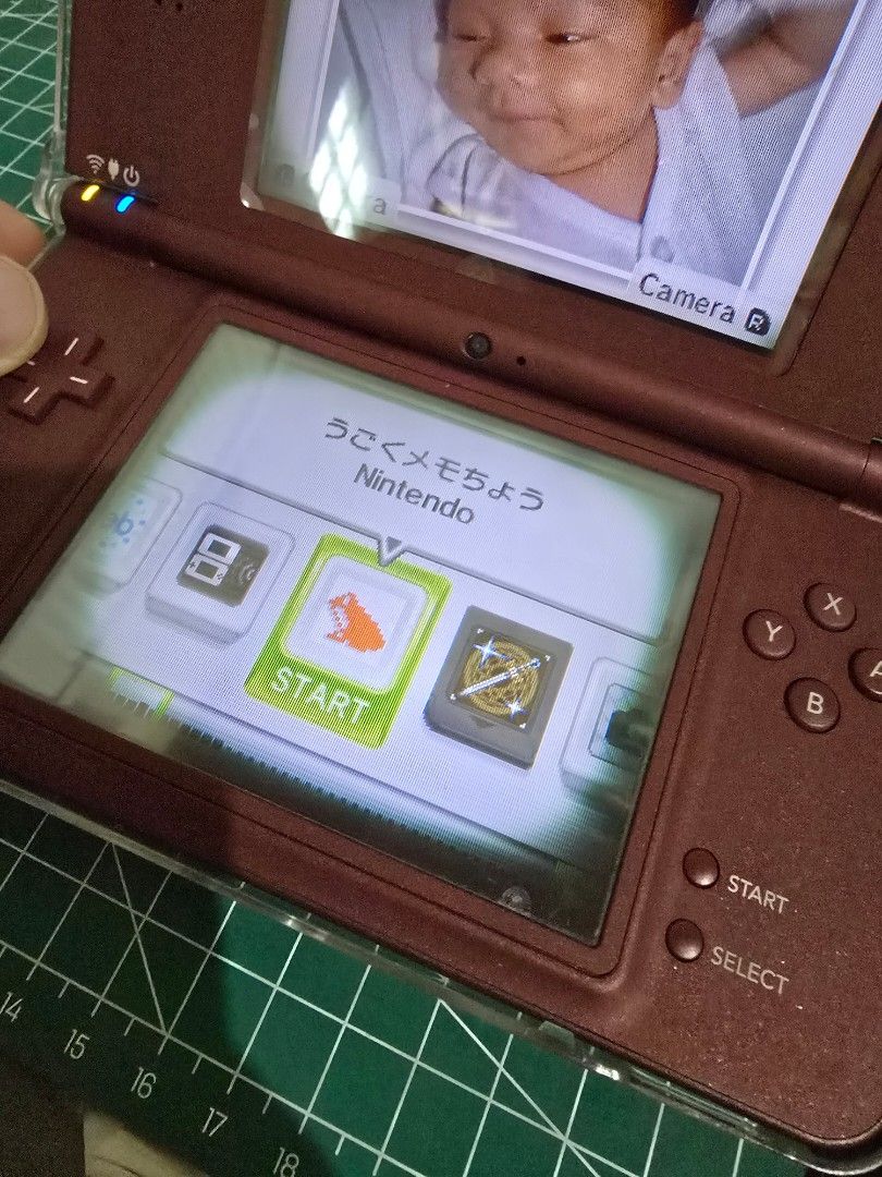 Nintendo DSi LL Burgundy (Category: Nintendo) located in Infanta. Submitted by acecarrot07 (Listing ID 1453249490, Image 2). Description: RFS: considering an upgrade to 3ds Issues: vignette on both screens, minor scratches - Nintendo DS LL (Burgundy) - Tested and working - Minor cosmetic scratches on the casing - Ideal for gaming on the go - MODDED inclusions: charger, stylus, R4 card, sd card, hard protective case Mode of payment: GCASH or Mari 