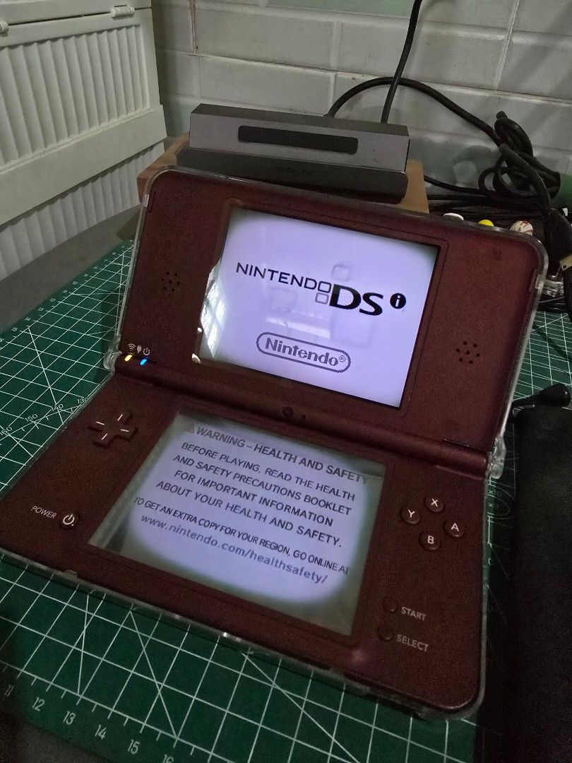 Nintendo DSi LL Burgundy (Category: Nintendo) located in Infanta. Submitted by acecarrot07 (Listing ID 1453249490, Image 1). Description: RFS: considering an upgrade to 3ds Issues: vignette on both screens, minor scratches - Nintendo DS LL (Burgundy) - Tested and working - Minor cosmetic scratches on the casing - Ideal for gaming on the go - MODDED inclusions: charger, stylus, R4 card, sd card, hard protective case Mode of payment: GCASH or Mari 