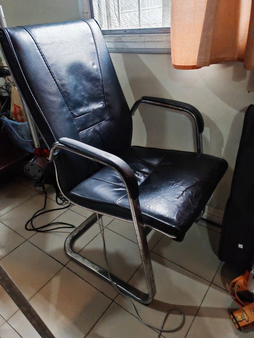 Office or Computer Chair with Chrome Base (Category: Chairs) located in Quezon City. Submitted by jk1225777 (Listing ID 1453261357, Image 2). Description: get it off my hands for 500. scout fuentebella area. flaw on pic. as is where is. matibay. rfs: decluttering - Black faux leather office chair - Chrome cantilever base - Sturdy frame - Ideal for home office or study.