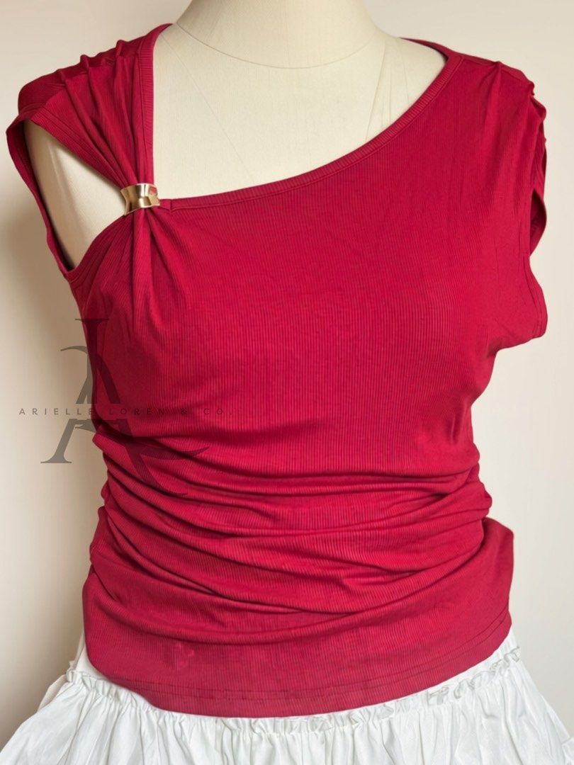 One-Shoulder Asymmetrical Top with Gold Ring Detail (Category: Blouses) located in Manila. Submitted by ariellelorenco (Listing ID 1453381017, Image 2). Description: - Trendy red one-shoulder top - Features a chic gold ring detail on the strap - Comfortable ribbed fabric - Flattering side ruching - Short sleeves for a relaxed fit - Perfect for dressing up or down -Free size up to XL -Very stretchy fabric -Bust up to 40in max -With side ruched to 