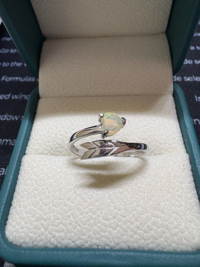 Opal Ring (Category: Rings) located in Singapore. Submitted by Discoverme (Listing ID 1453340501, Image 1). Description: ✨ Natural Opal Ring – S925 Sterling Silver Elegant S925 sterling silver ring featuring a genuine natural opal with beautiful flashes of green play-of-colour. The graceful leaf-inspired setting creates a timeless and feminine design, perfect for everyday wear or special occasions..