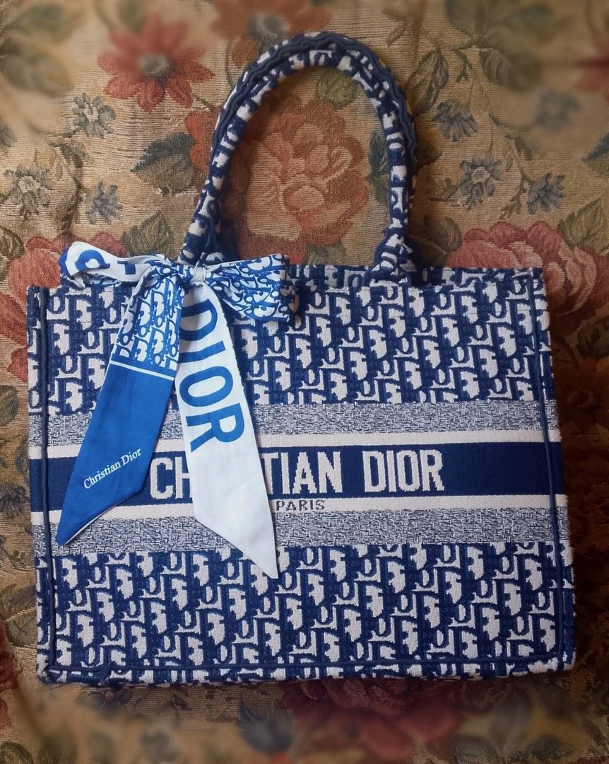 Preloved CHRISTIANDIOR BOOK TOTE MEDIUM (Category: Luxury Bags & Wallets) located in Alicia. Submitted by celynahambotruecelyna39 (Listing ID 1453335370, Image 1). Description: in good condition.